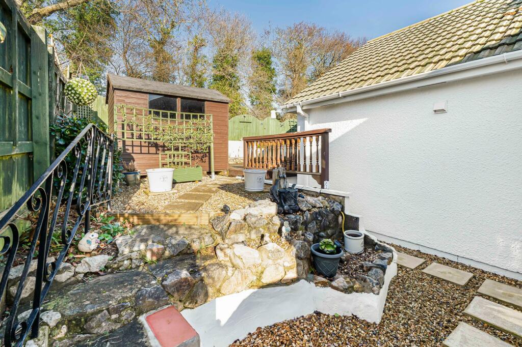Side garage leading to front garden