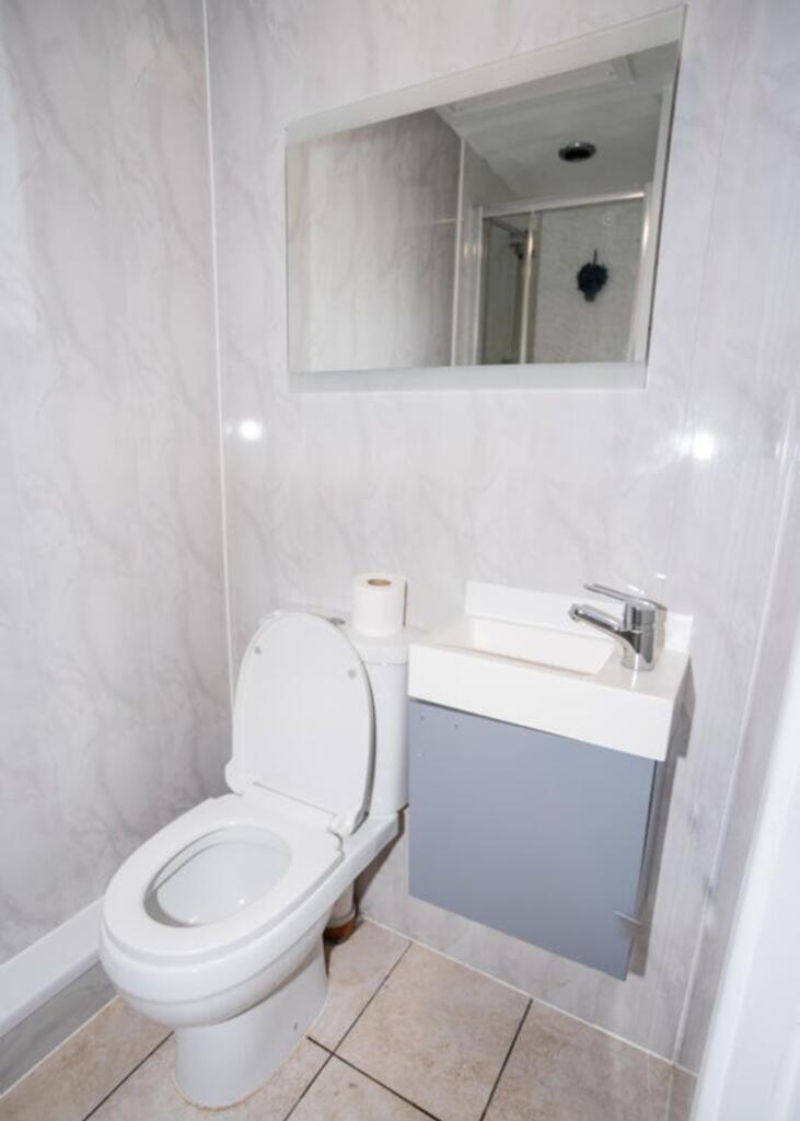 Modern single toilet featuring sleek design and...