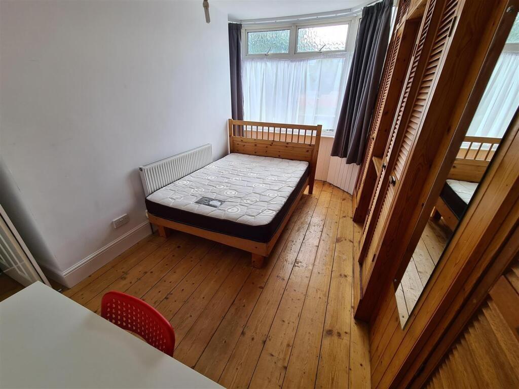 Bright and inviting double bedroom featuring a ...