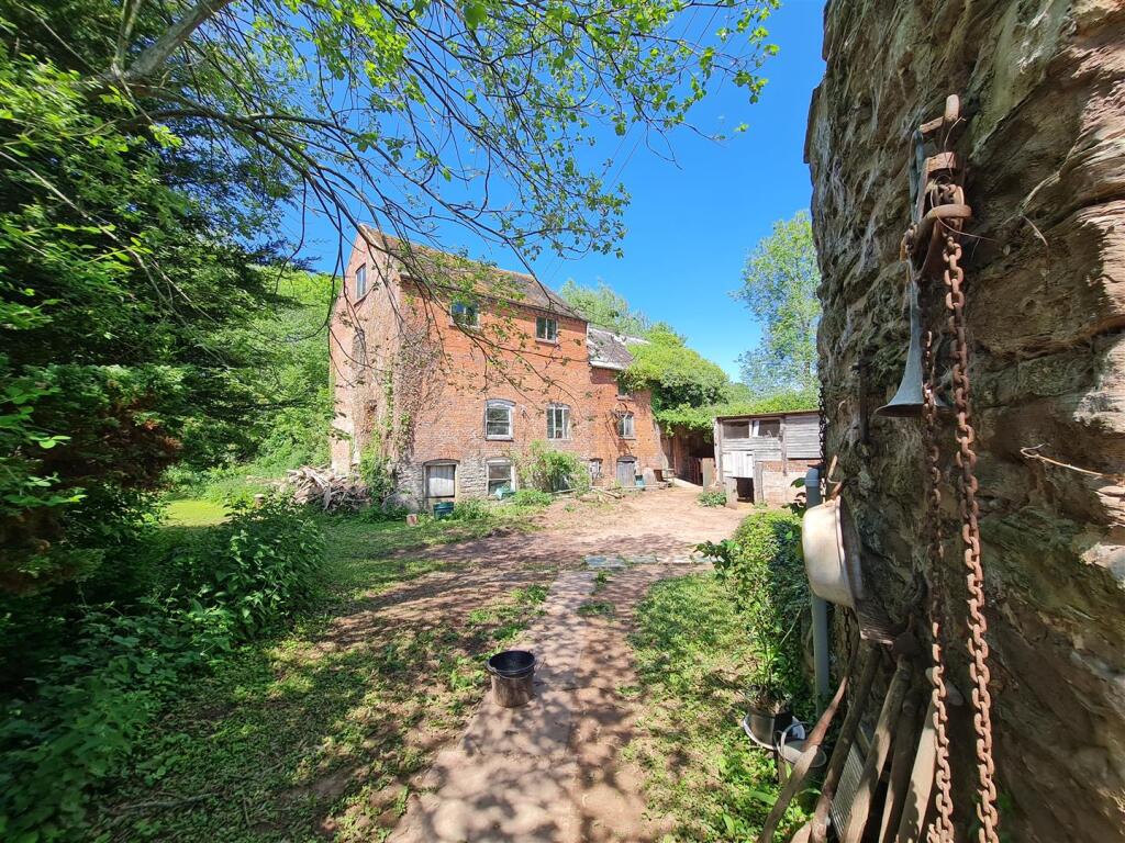 Mill building from garden gate 2.jpg