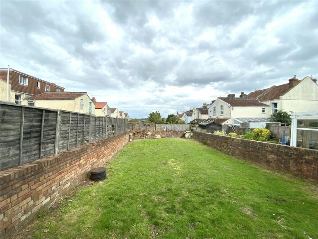 A spacious garden featuring a well-maintained l...