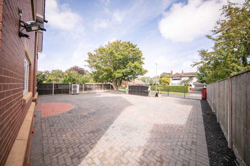 Block paved driveway with powered sec...