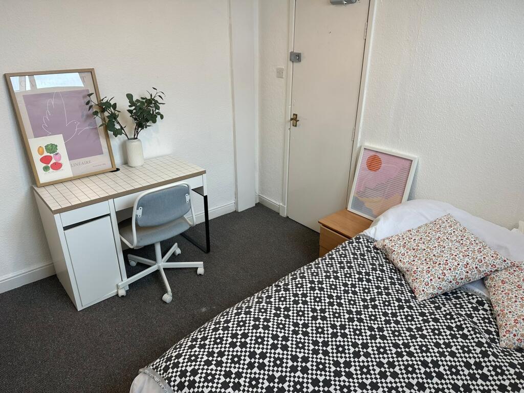 Bright and inviting bedroom featuring a comfort...