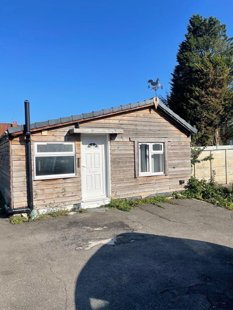 Charming wooden facade of a detached property w...