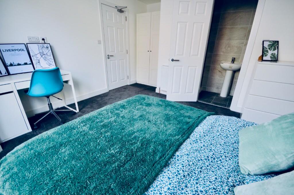 A bright and inviting double bedroom featuring ...