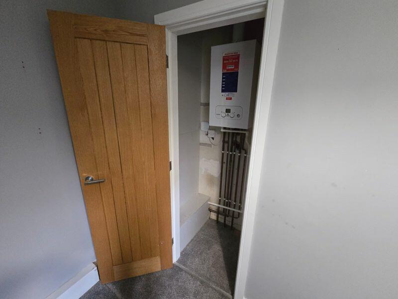 Cupboard housing boiler
