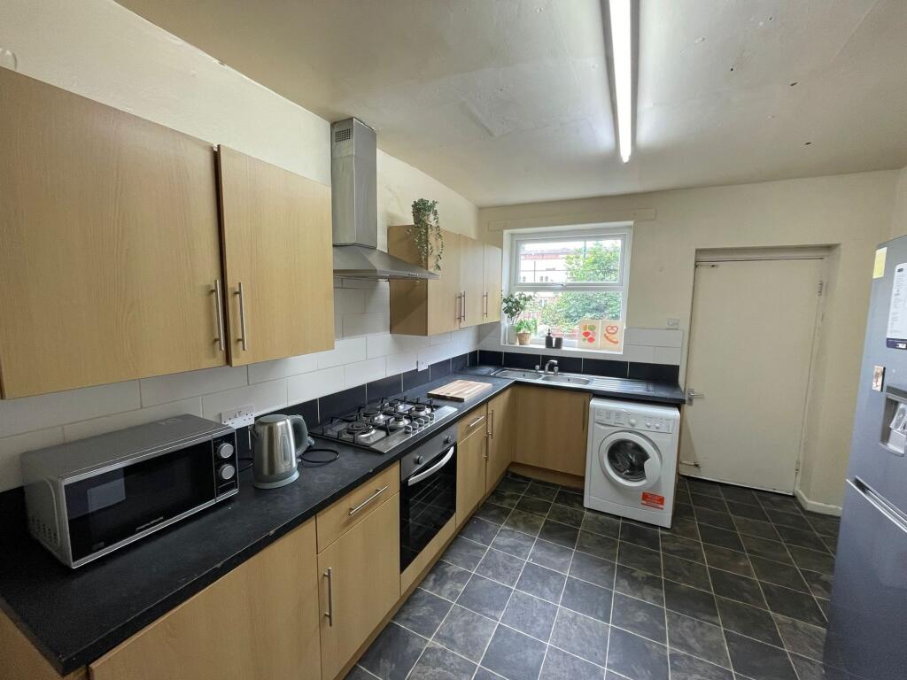Modern and functional kitchen area with wooden ...