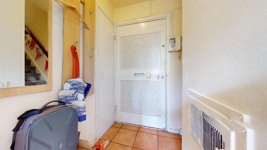 A tidy and practical entrance hallway featuring...