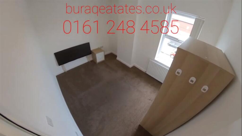 A simple, neat single bedroom featuring a bed, ...