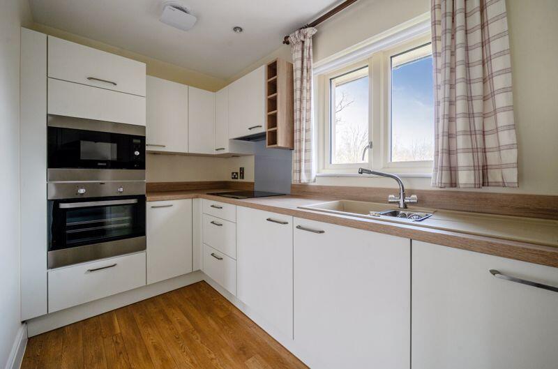 Kitchen with built-in appliances