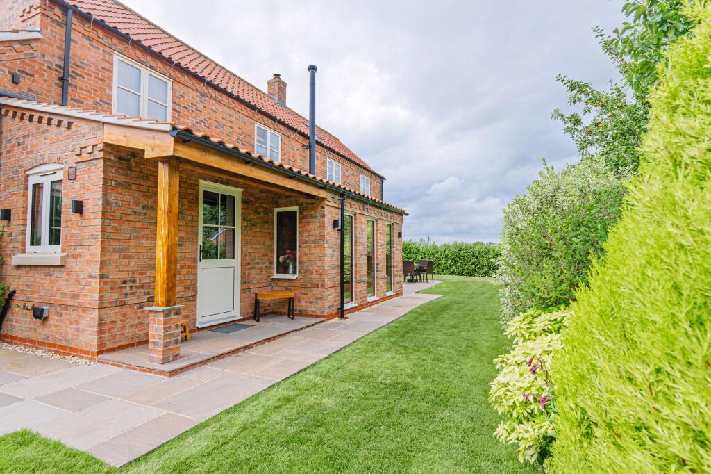 Garden can be accessed by two gates at both sides of the home