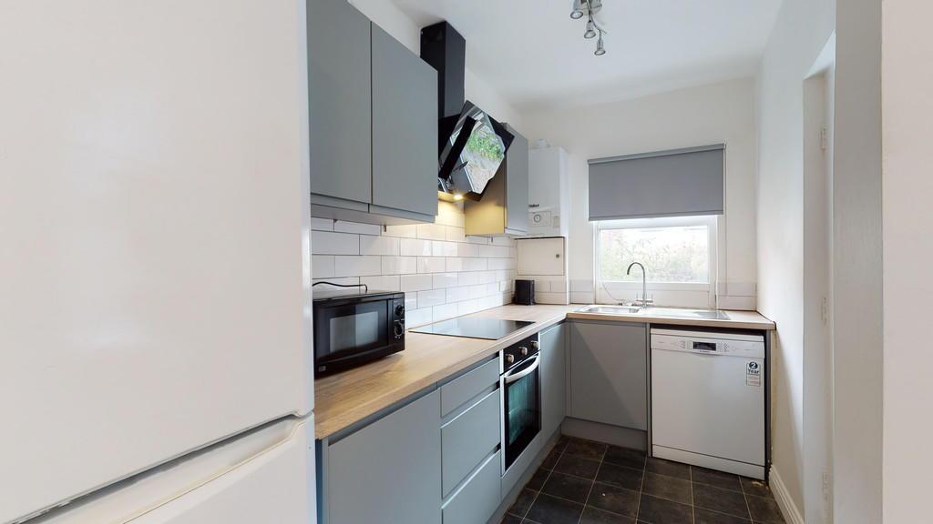 A modern and well-maintained kitchen with sleek...