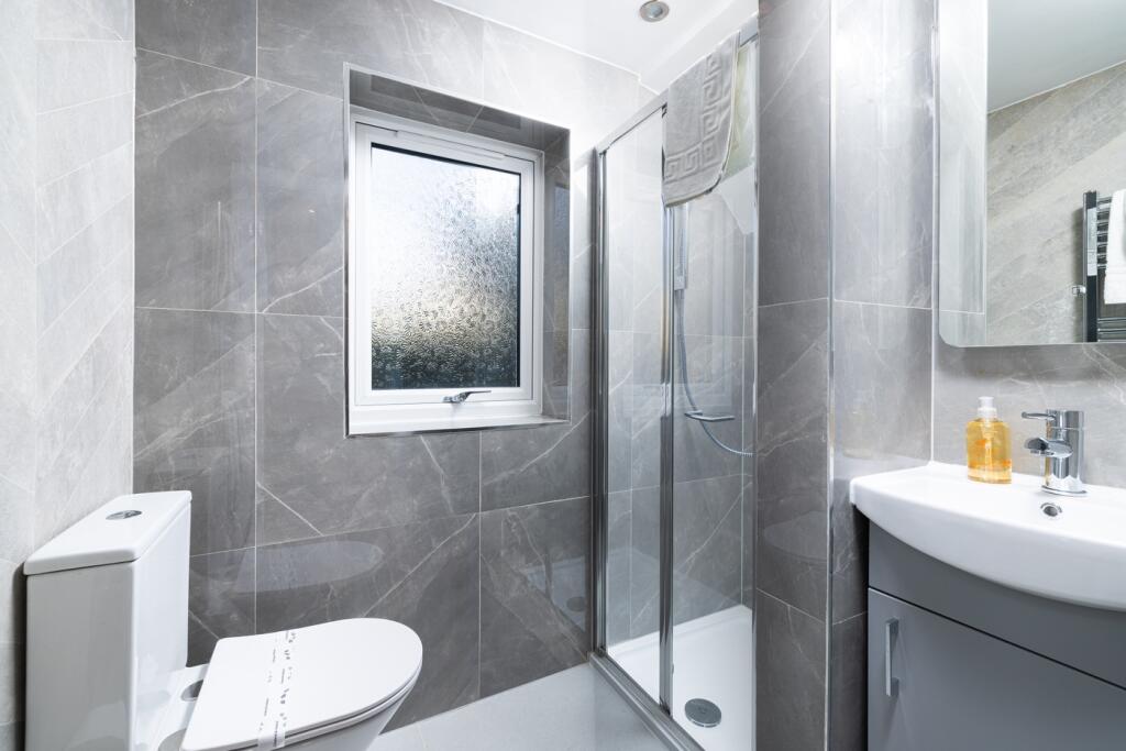 This modern bathroom features a sleek design wi...