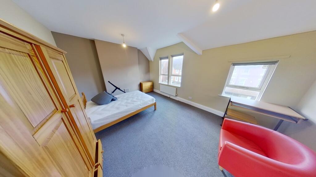 Bright and cozy double bedroom featuring a larg...