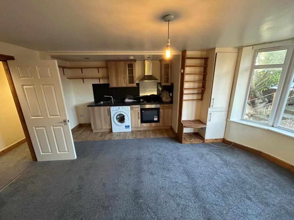 A spacious and welcoming living area featuring ...