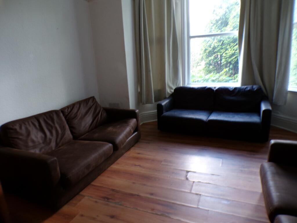 Spacious living room featuring comfortable seat...