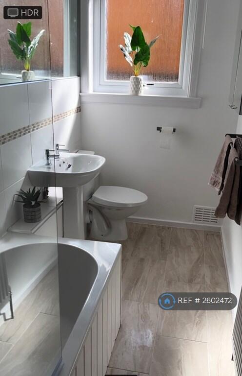 Large Modern Bathroom With Bath, Shower And Tiling