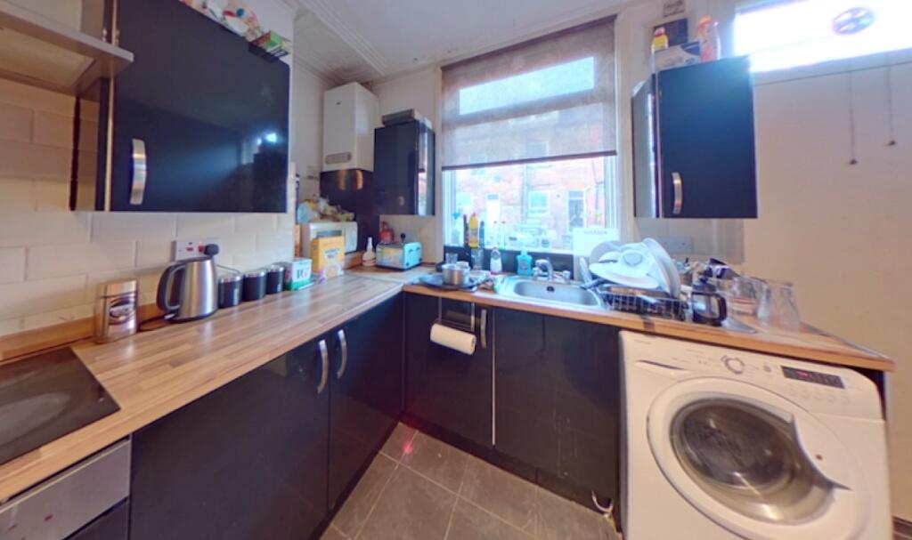 Bright and functional kitchen featuring ample c...