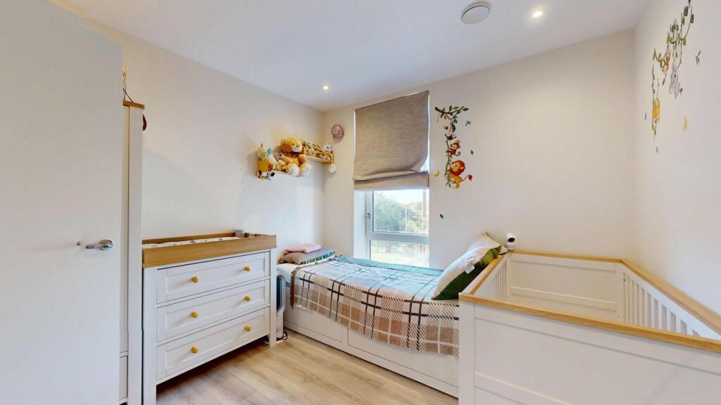 A bright and tidy master bedroom featuring a sp...