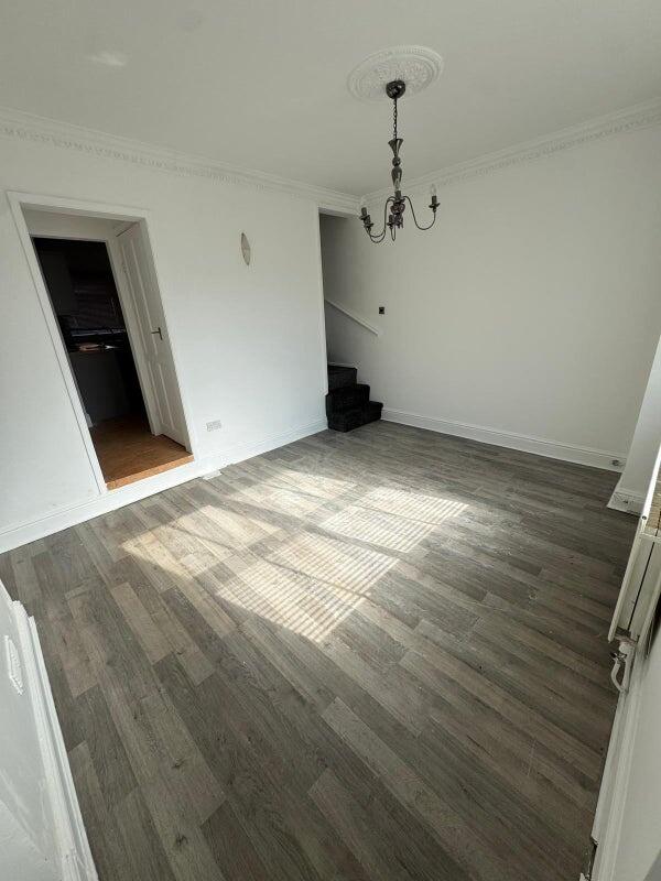 Bright living room featuring a modern wood-styl...