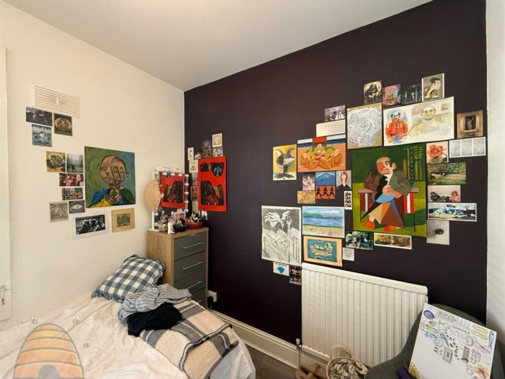 A vibrant and inviting double bedroom adorned w...