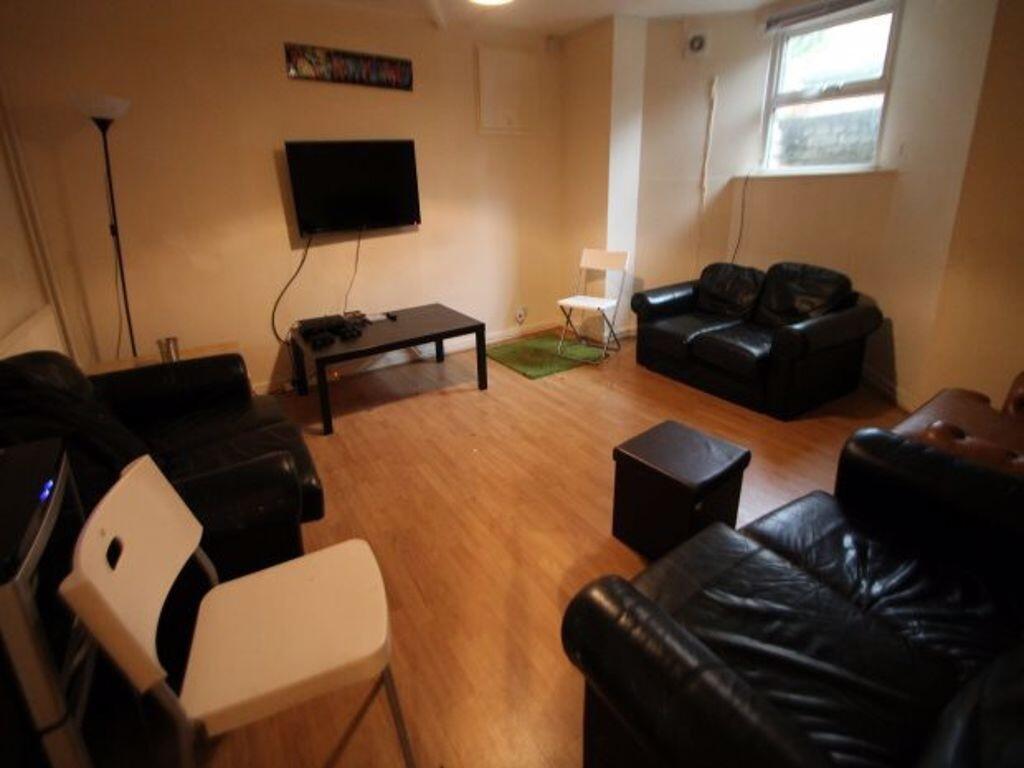 A spacious and modern living room featuring com...