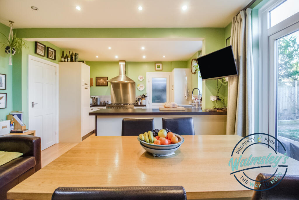 Dining area with kitchen and breakfast bar