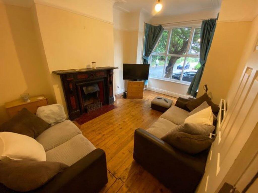 A cozy and inviting living room featuring comfo...