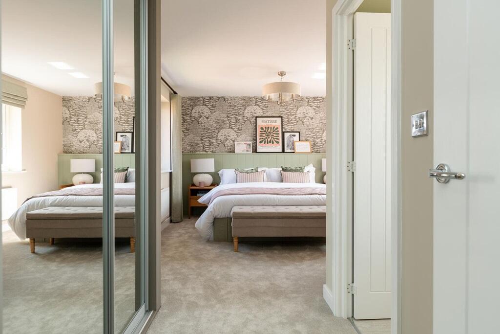 The large main bedroom is bursting with natural light