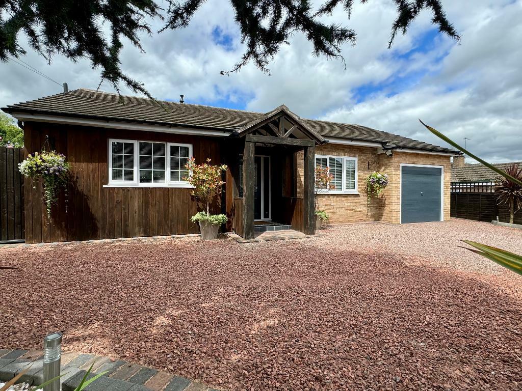 Front elevation with driveway parking