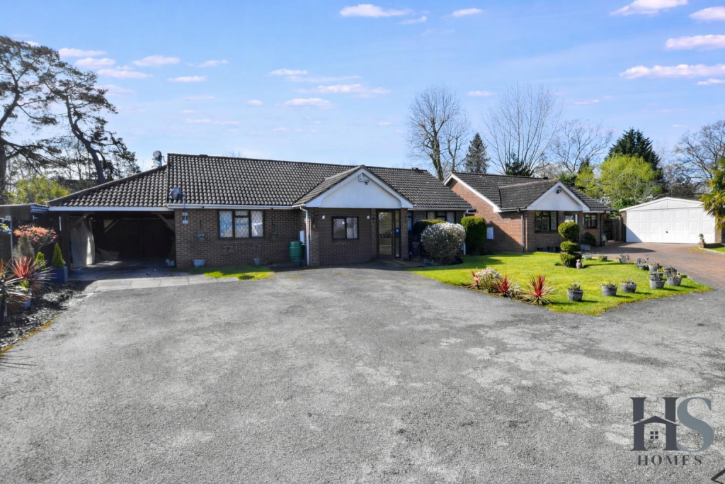 Charming bungalow with lush greenery.png