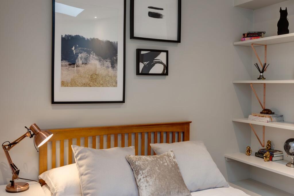 A cozy and well-maintained bedroom featuring ne...