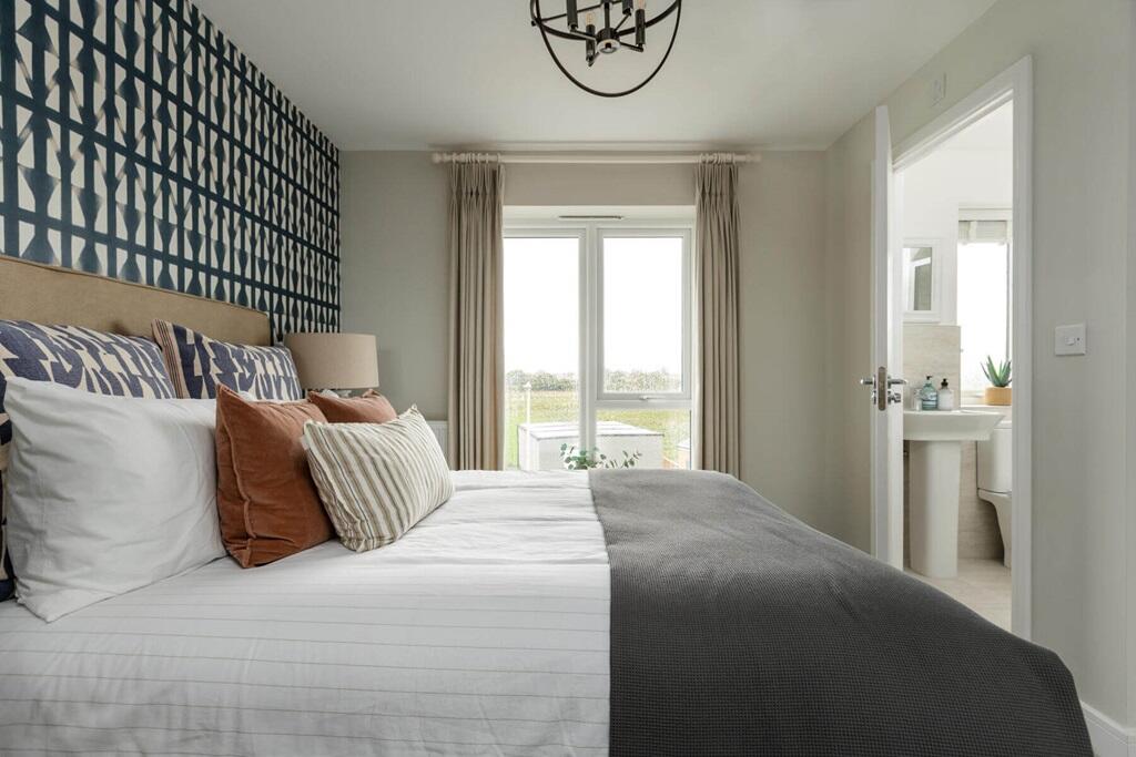The main bedroom hosts an en-suite, the relaxing space to unwind