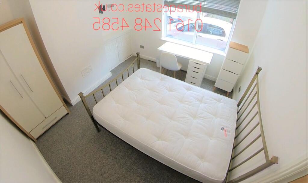 Bright, simply furnished double bedroom with a ...