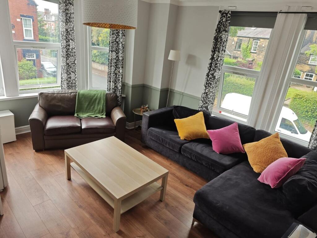 Bright and welcoming living room with comfortab...