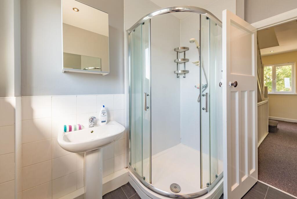 Bright and clean bathroom featuring a modern co...