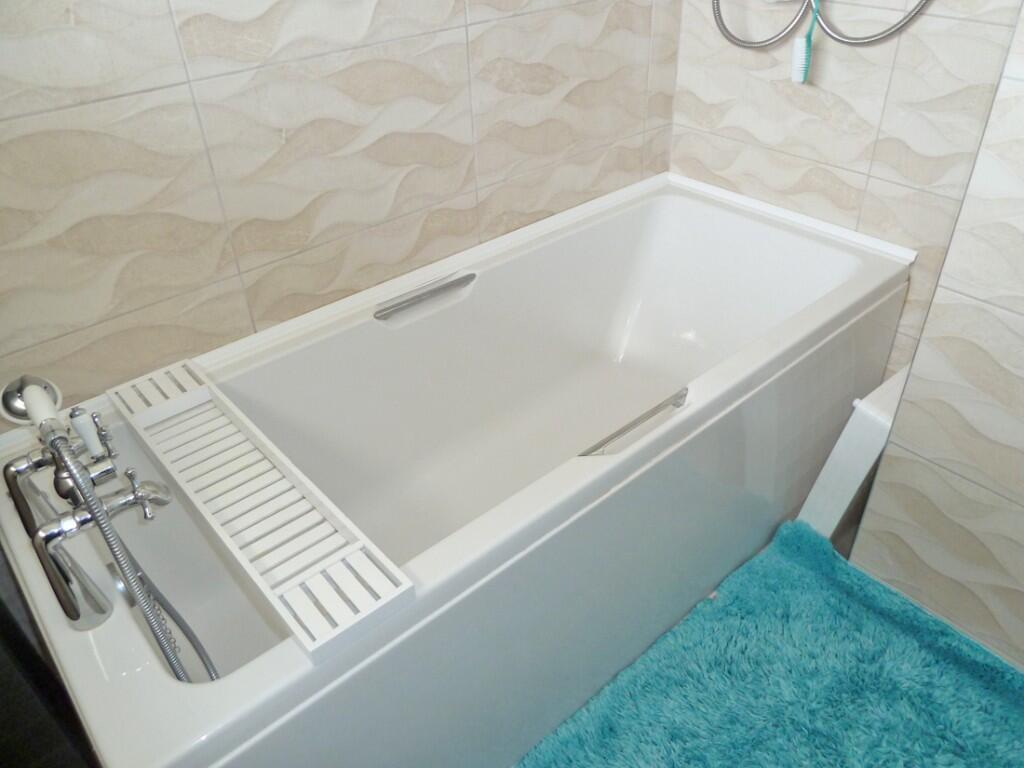 Bath, shower above.