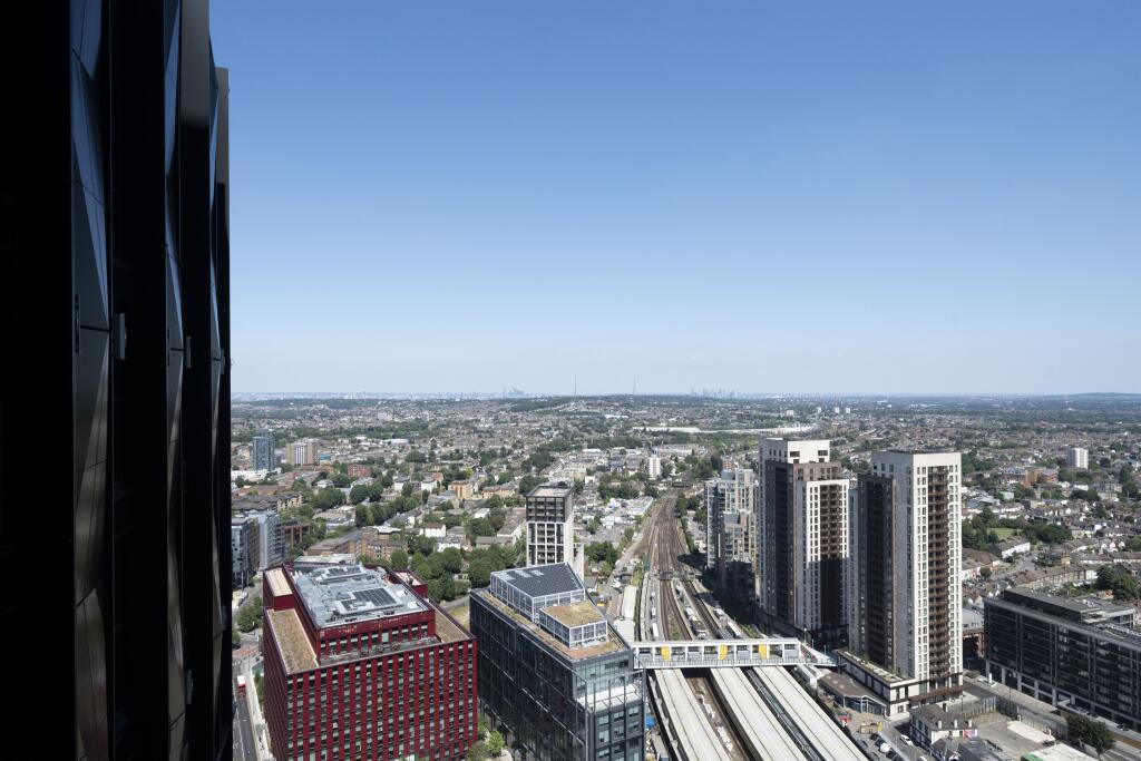 Experience breathtaking city views from your apartment, overlooking vibrant urban life.