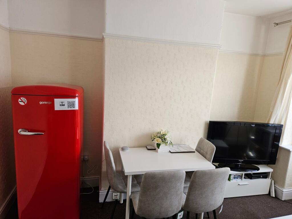 A bright and clean kitchenette featuring modern...