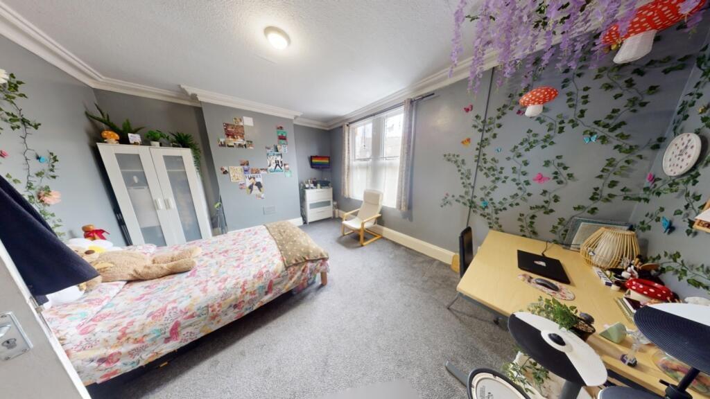 Bright and inviting master bedroom featuring a ...