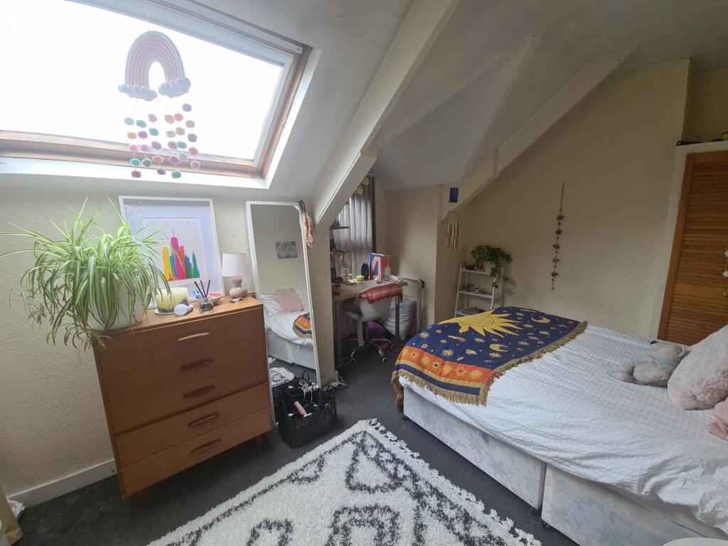 Bright and cozy double bedroom featuring a comf...