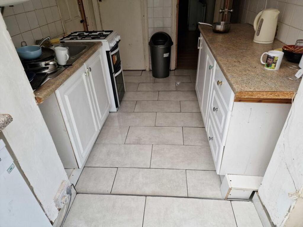 A functional kitchenette with a clean and tidy ...