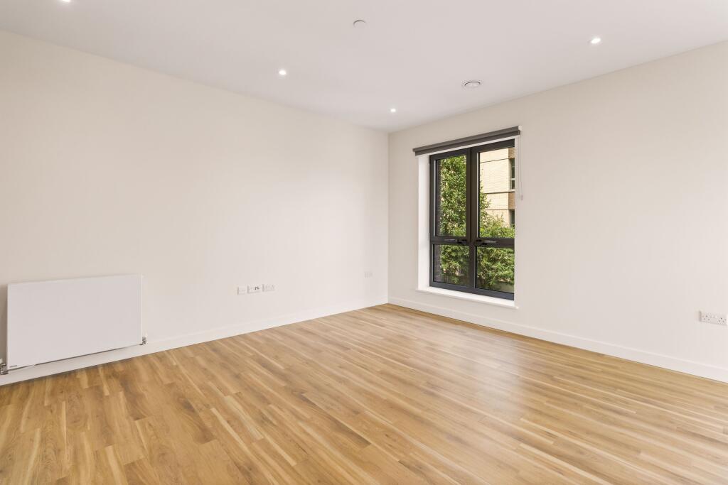 Embrace elegance in a spacious, sunlit room with modern finishes.