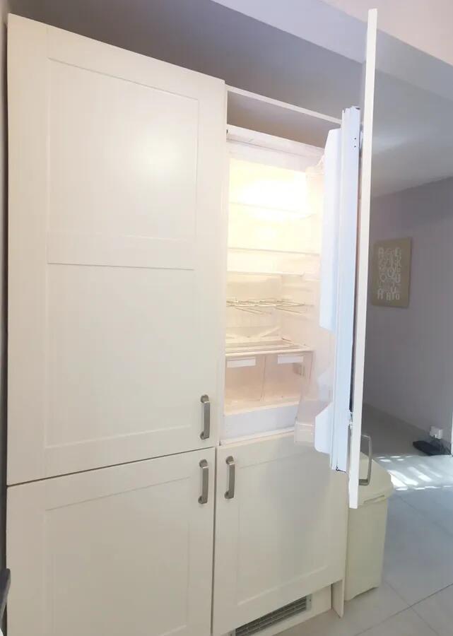 Bright and clean contemporary kitchen featuring...