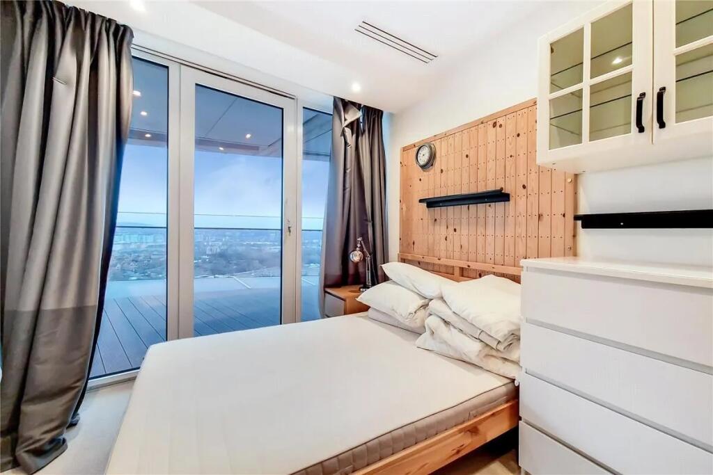 Bright and modern double bedroom featuring a la...