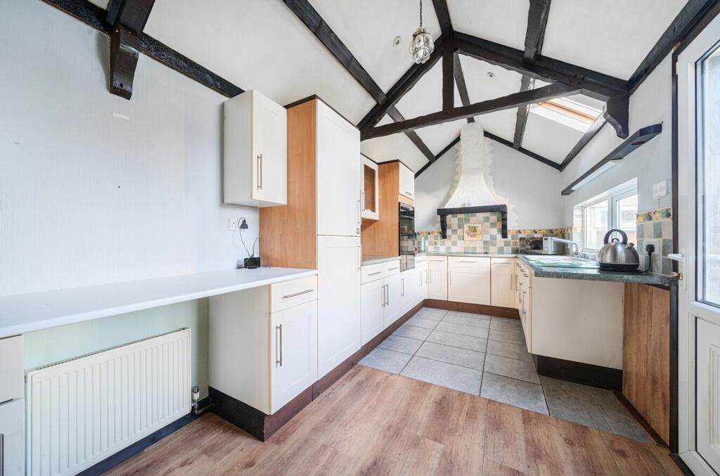 Living/dining area with kitchen/utility area