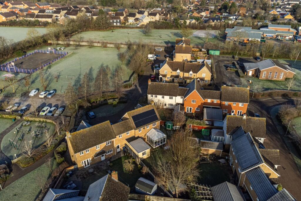 Aerial view of the home and surroundings
