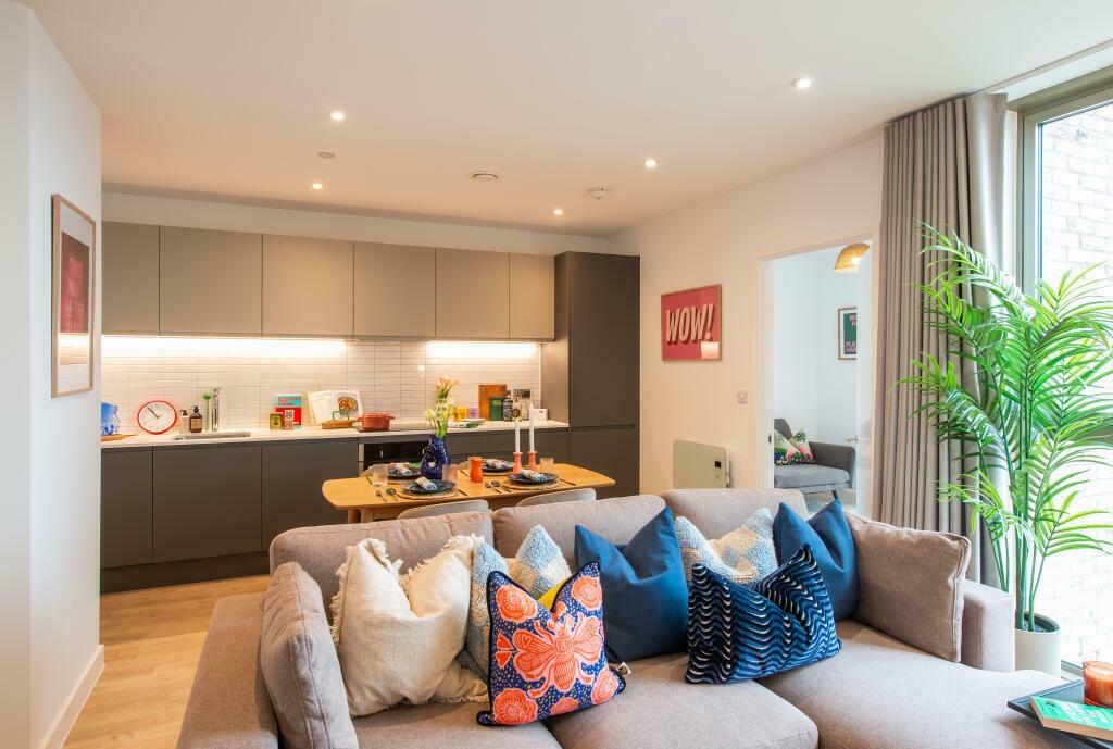 A stylish and contemporary living room with a c...