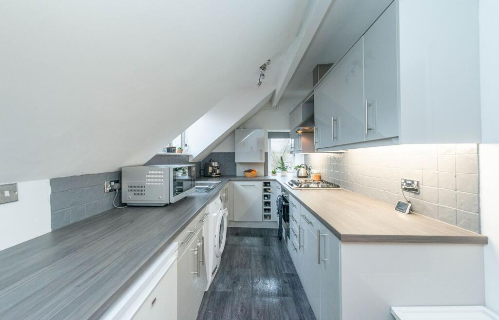 SITTING ROOM AND KITCHEN