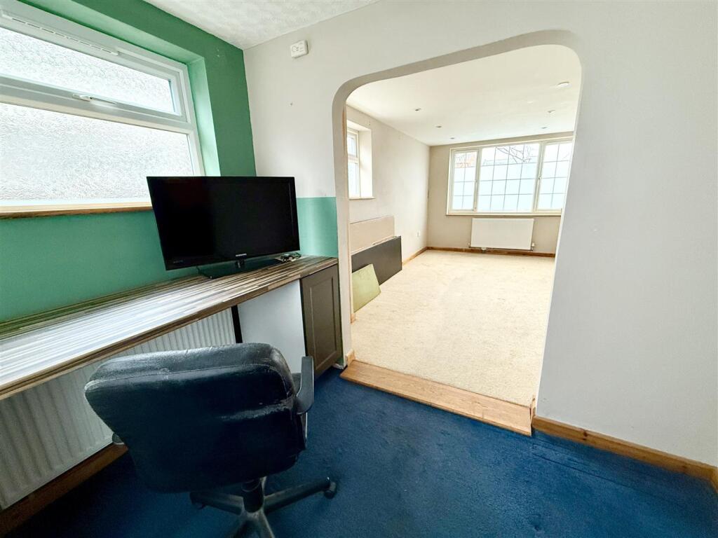 study opening to reception room